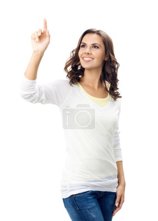 Photo for Happy smiling young woman showing something or empty place for some text, slogan, advertisement or copyspace, isolated against white background - Royalty Free Image