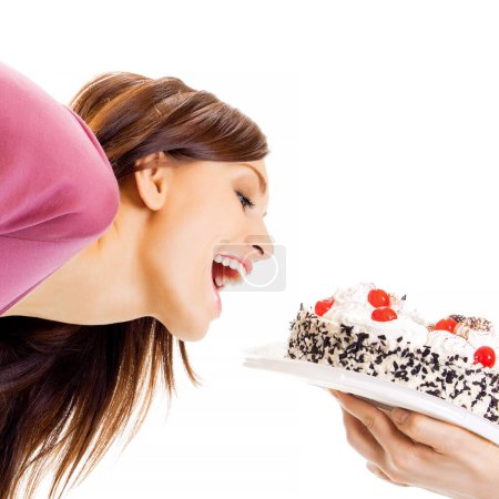 Téléchargez les photos : Femme gaie manger tarte, isolé sur fond blanc - en image libre de droit