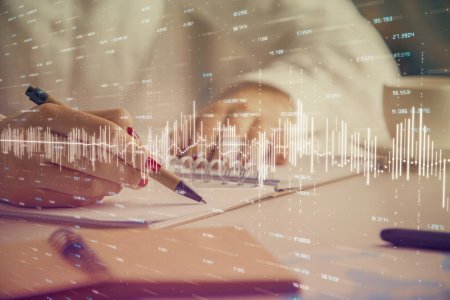 Photo for Double exposure of woman's hands making notes with forex graph hologram. Concept technical analysis. - Royalty Free Image