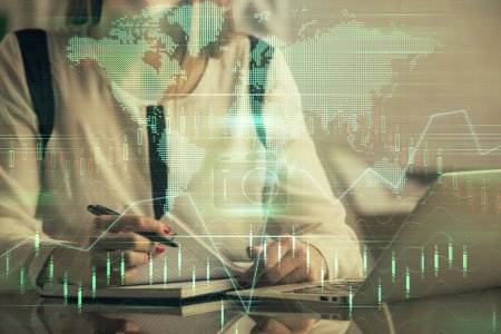 Photo for Double exposure of businesswoman hands typing on computer and financial graph hologram drawing. Stock market analysis concept. - Royalty Free Image