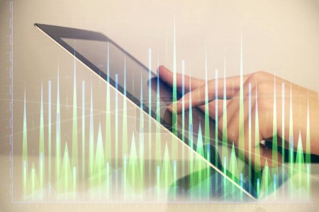 Photo for Multi exposure of man's hands holding and using a digital phone and forex graph drawing. Financial market concept. - Royalty Free Image