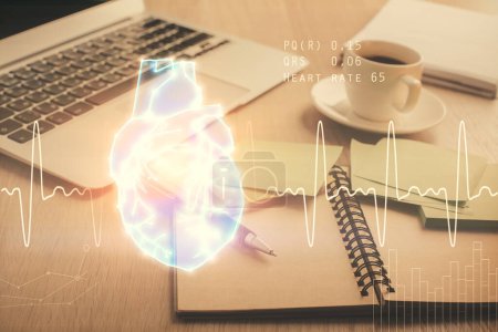 Photo for Double exposure of heart drawing and desktop with coffee and items on table background. Concept of medical education - Royalty Free Image