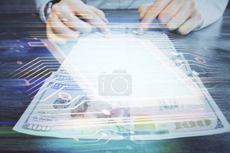 Photo for Double exposure of technology drawing hologram and us dollars bills and man hands. Data concept - Royalty Free Image