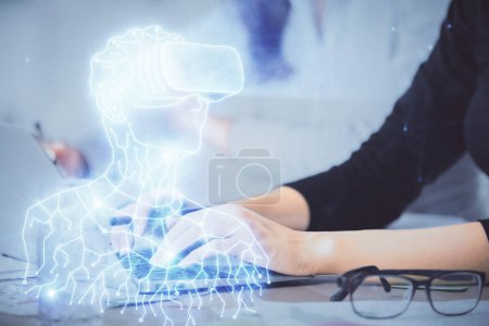 Foto de Doble exposición de las manos de la mujer escribiendo en el ordenador y el hombre en el dibujo gafas AR. Concepto educativo. - Imagen libre de derechos