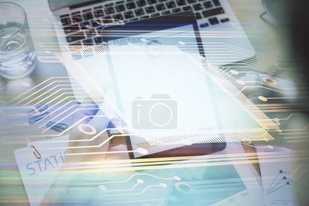 Photo for Double exposure of man's hand holding and using a digital device and data theme hologram drawing. Technology concept. - Royalty Free Image