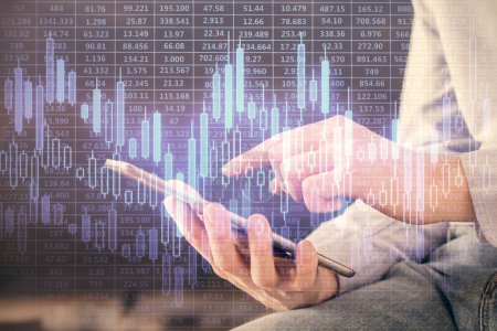 Photo for Double exposure of man's hands holding and using a digital device and forex graph drawing. Financial market concept. - Royalty Free Image