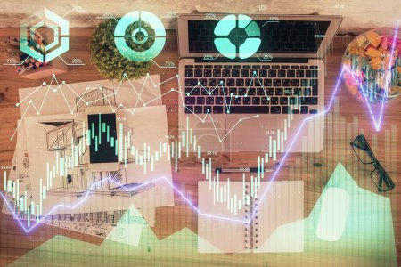 Photo for Multi exposure of financial chart drawing over table background with computer. Concept of research. Top view. - Royalty Free Image