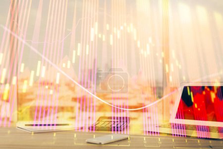 Photo for Forex Chart hologram on table with computer background. Multi exposure. Concept of financial markets. - Royalty Free Image