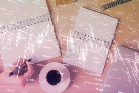 Photo for Multi exposure of woman's hands making notes with forex graph hologram. Concept of technical analysis. - Royalty Free Image