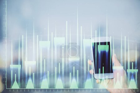 Photo for Double exposure of forex chart sketch hologram and woman holding and using a mobile device. Stock market concept. - Royalty Free Image