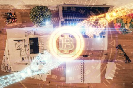 Photo for Blockchain theme hologram drawings over computer on the desktop background. Top view. Double exposure. - Royalty Free Image