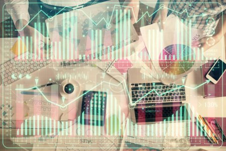 Photo for Double exposure of man and woman working together and financial chart hologram drawing. market analysis concept. Computer background. Top View. - Royalty Free Image