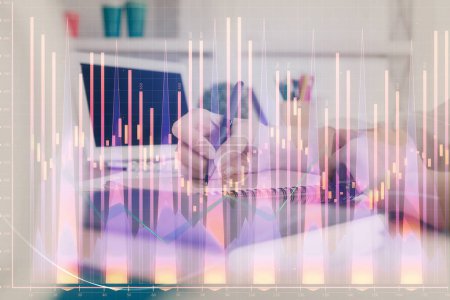 Photo for Financial graph displayed on woman's hand taking notes background. Concept of research. Double exposure - Royalty Free Image
