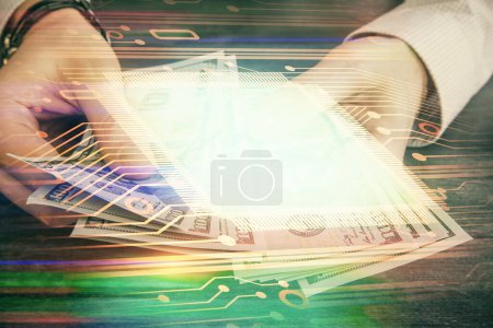 Photo for Multi exposure of technology drawing hologram and us dollars bills and man hands. Data concept - Royalty Free Image