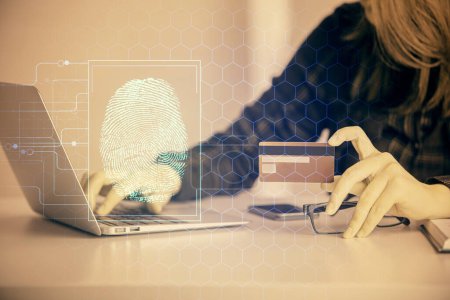 Photo for Multi exposure of woman on-line shopping holding a credit card and finger print drawing. Security concept. - Royalty Free Image