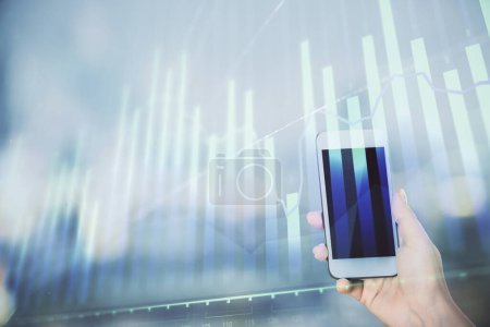 Photo for Double exposure of forex chart sketch hologram and woman holding and using a mobile device. Stock market concept. - Royalty Free Image