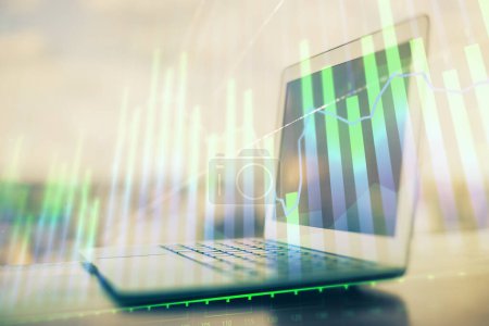 Photo for Forex Chart hologram on table with computer background. Multi exposure. Concept of financial markets. - Royalty Free Image