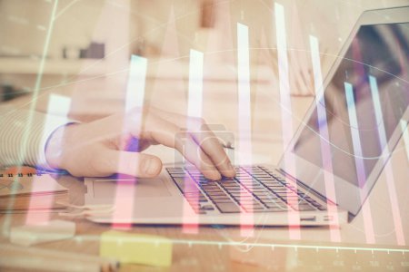 Photo for Double exposure of stock market graph with man working on laptop on background. Concept of financial analysis. - Royalty Free Image