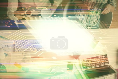 Photo for Double exposure of man and woman working together and data theme hologram drawing. Computer background. Top View. - Royalty Free Image