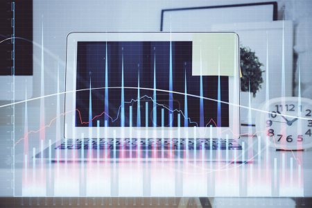 Photo for Stock market graph on background with desk and personal computer. Multi exposure. Concept of financial analysis. - Royalty Free Image