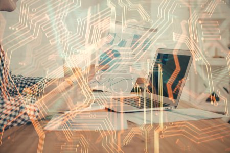 Photo for Technology theme hologram with man working on computer on background. High tech concept. Double exposure. - Royalty Free Image