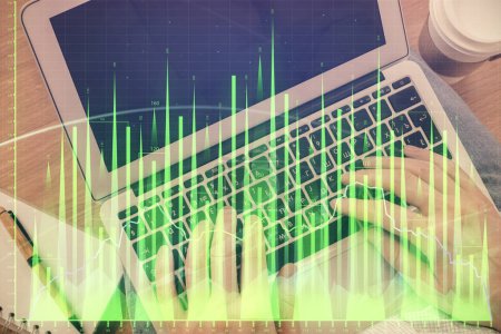 Photo for Double exposure of man's hands typing over computer keyboard and forex graph hologram drawing. Top view. Financial markets concept. - Royalty Free Image