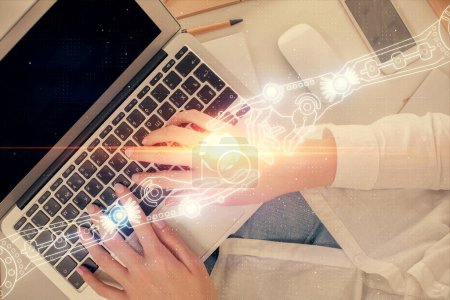 Foto de Doble exposición de las manos de las mujeres que trabajan en la computadora y el tema de datos holograma dibujo. Vista superior. Concepto tecnológico. - Imagen libre de derechos