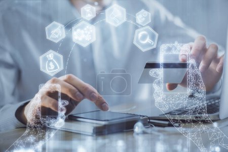 Photo for Double exposure of man hands holding a credit card and tech theme drawing. Technology in E-commerce concept. - Royalty Free Image