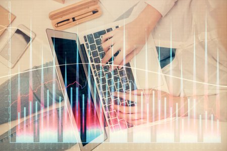 Photo for Double exposure of woman hands working on computer and forex graph hologram drawing. Top View. Financial analysis concept. - Royalty Free Image
