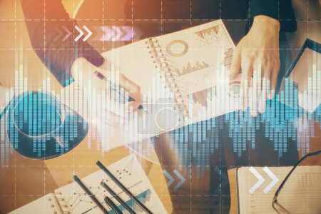 Photo for Multi exposure of hands making notes with forex chart huds. Stock market concept. - Royalty Free Image