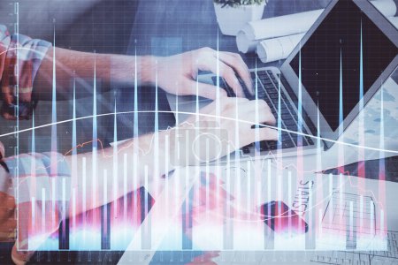Photo for Double exposure of stock graph with businessman typing on computer in office on background. Concept of hard work. - Royalty Free Image