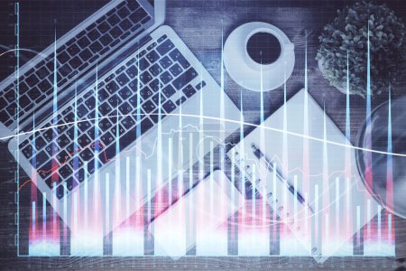Photo for Financial market graph and top view computer on the desktop background. Double exposure. Investment concept. - Royalty Free Image