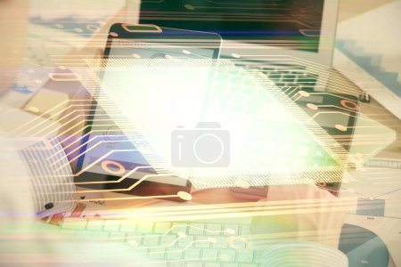 Photo for Double exposure of man's hand holding and using a digital device and data theme hologram drawing. Technology concept. - Royalty Free Image