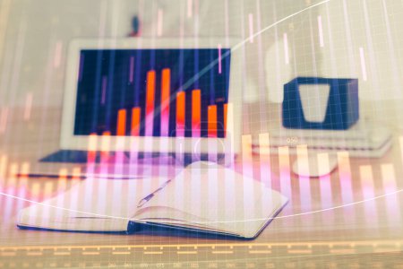 Photo for Stock market graph on background with desk and personal computer. Double exposure. Concept of financial analysis. - Royalty Free Image