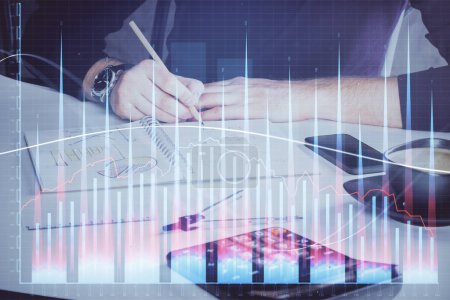 Photo for Double exposure of man doing analysis of stock market with forex graph. Concept of research and trading. - Royalty Free Image