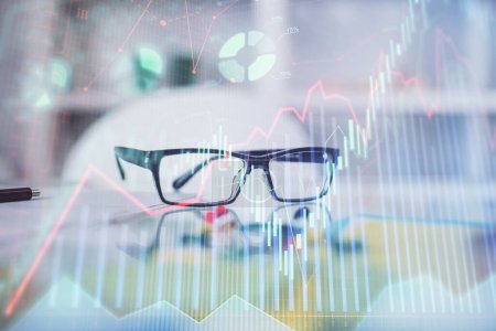 Photo for Financial chart hologram with glasses on the table background. Concept of business. Double exposure. - Royalty Free Image