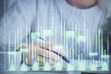 Photo for Forex chart displayed on woman's hand taking notes background. Concept of research. Multi exposure - Royalty Free Image