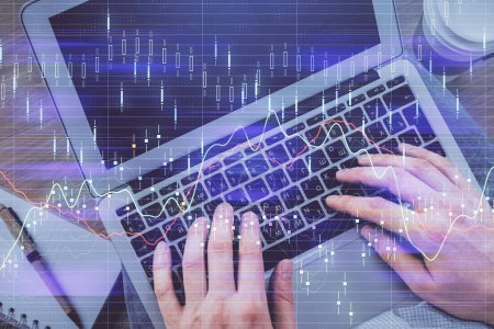 Photo for Double exposure of man's hands typing over computer keyboard and forex graph hologram drawing. Top view. Financial markets concept. - Royalty Free Image
