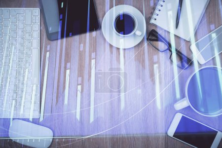 Photo for Double exposure of financial chart hologram over desktop with phone. Top view. Mobile trade platform concept. - Royalty Free Image