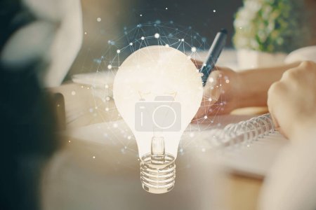 Photo for Drawing bulb over woman's hands taking notes background. Concept of idea. Double exposure - Royalty Free Image