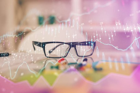 Photo for Financial chart hologram with glasses on the table background. Concept of business. Double exposure. - Royalty Free Image