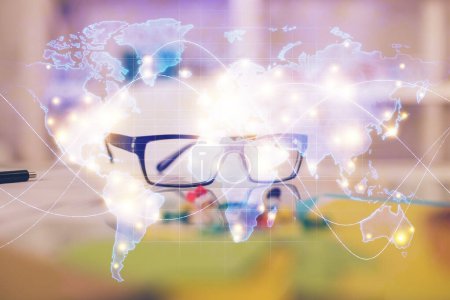 Photo for Business theme hologram with glasses on the table background. Concept of search. Double exposure. - Royalty Free Image