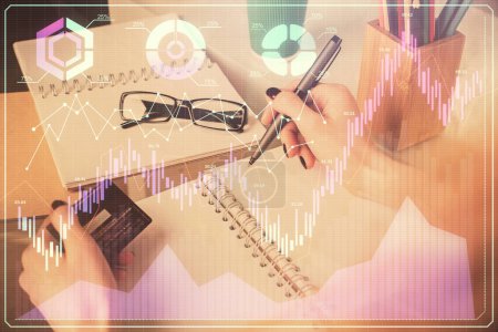 Photo for Multi exposure of woman on-line shopping holding a credit card and financial graph drawing. Stock market E-commerce concept. - Royalty Free Image