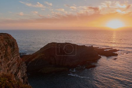 Photo for Stunning sunset over the ocean. West of Algarve region, Portugal - Royalty Free Image