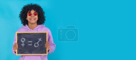 Photo for Isolated girl with blackboard and equality concept - Royalty Free Image