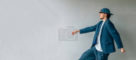 Photo for Young man isolated on the street wall - Royalty Free Image