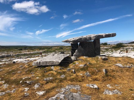 Photo for The Poulnabrone Dolmen is located near the townland of Caherconnell in co. Clare, Ireland. A dolmen is a type of single-chamber megalithic tomb - Royalty Free Image