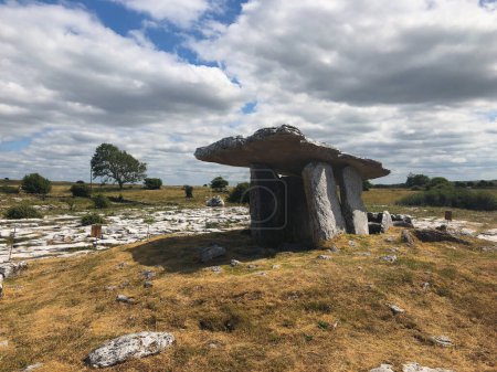 Photo for The Poulnabrone Dolmen is located near the townland of Caherconnell in co. Clare, Ireland. A dolmen is a type of single-chamber megalithic tomb - Royalty Free Image