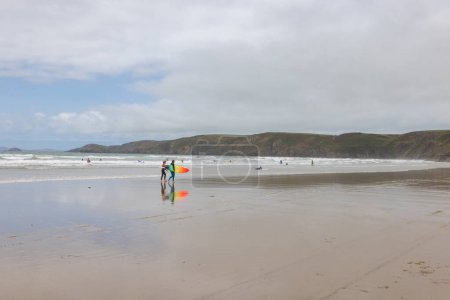 Photo for Newgale, Wales - 29 August 2023: Surfing on the Newgale Beach suitable for kitesurfing - Royalty Free Image