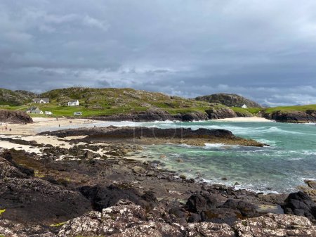 Photo for Amazing Clachtoll Beach in Lochinver, Scotland. Clachtoll Beach is a popular beach with some rugged terrain, including the Split Rocks - Royalty Free Image
